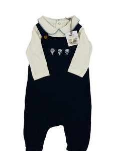 Nové krémové body a modrý overal Tu