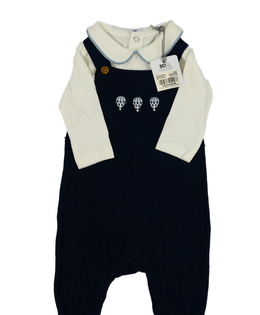 Nové krémové body a modrý overal Tu