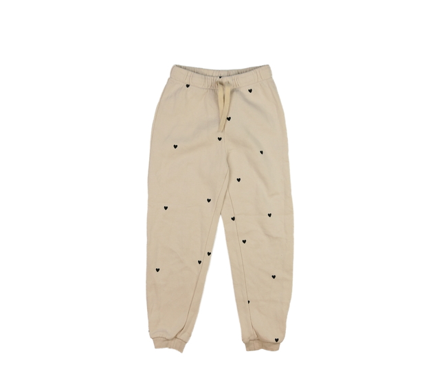 Krémové tepláky se srdíčky H&M