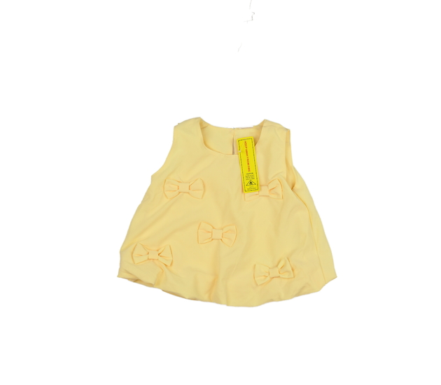 Nové žluté triko s mašlemi 